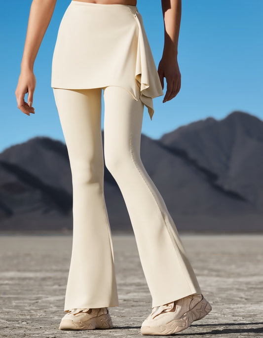 Women wearing beige hot yoga trousers and shoes in a outdoor desert setting with mountains in the background