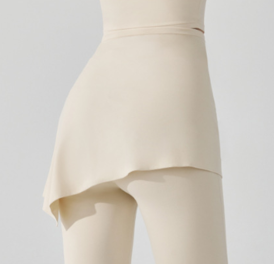 Beige dress on a mannequin against a plain background