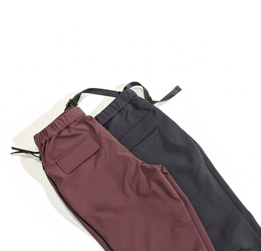 Brown and grey pants on a white background