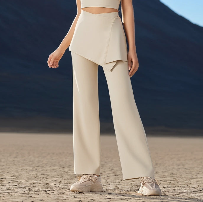 Women wearing a beige hot yoga trousers standing in a desert landscape