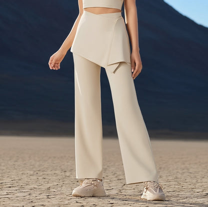 Women wearing a beige hot yoga trousers standing in a desert landscape